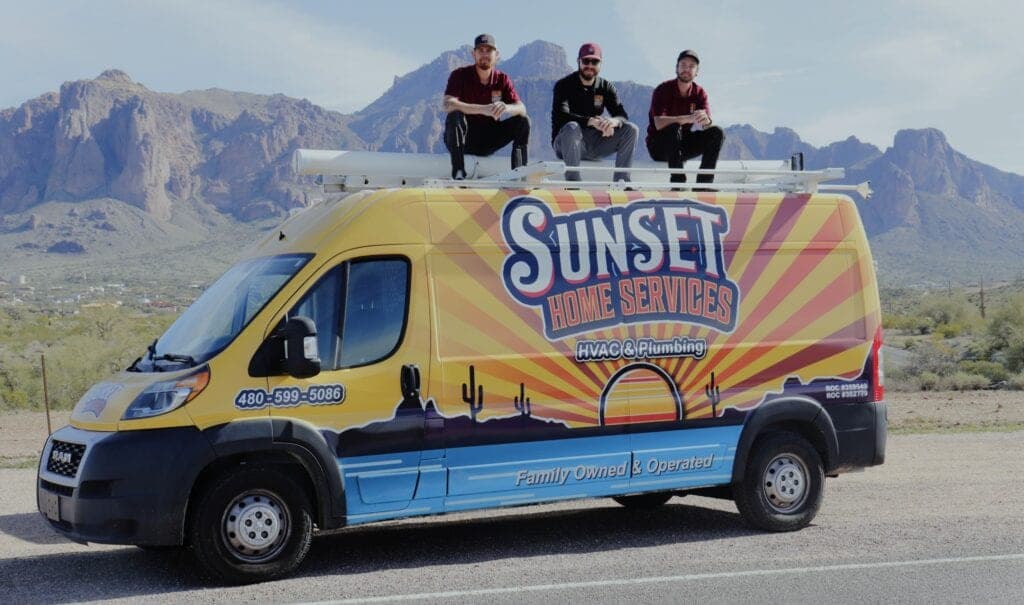 Sunset Home Services team with their wrapped HVAC and plumbing service van in Arizona